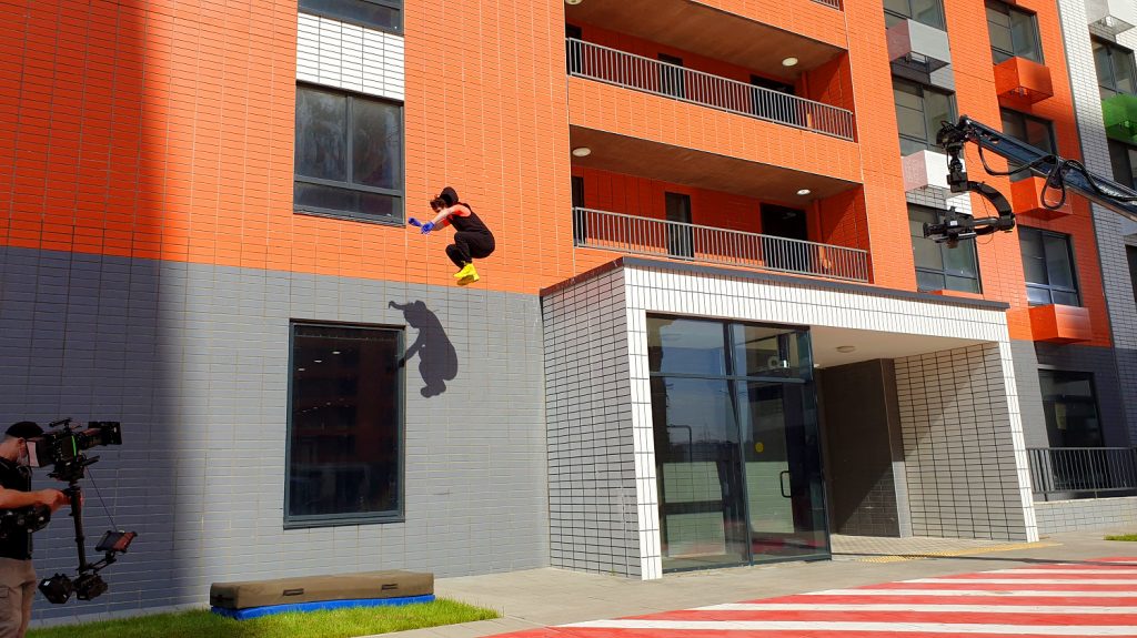 Stunt jump from the roof. Shooting a music video