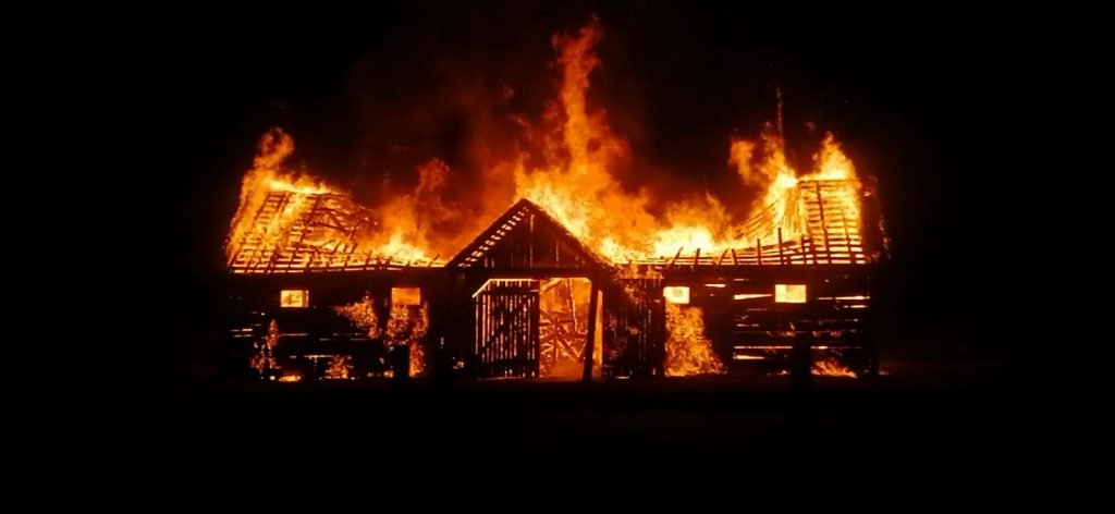 A fire in a stable with a roof collapse